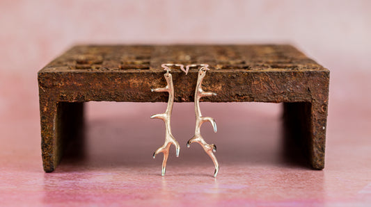 Long drop Antler earrings in rose gold with the tips polished back to reveal the sterling silver underneath